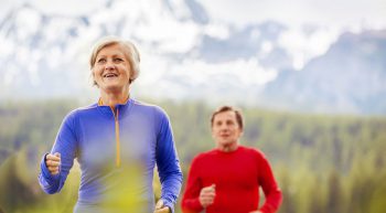 healthy middle aged couple jogging